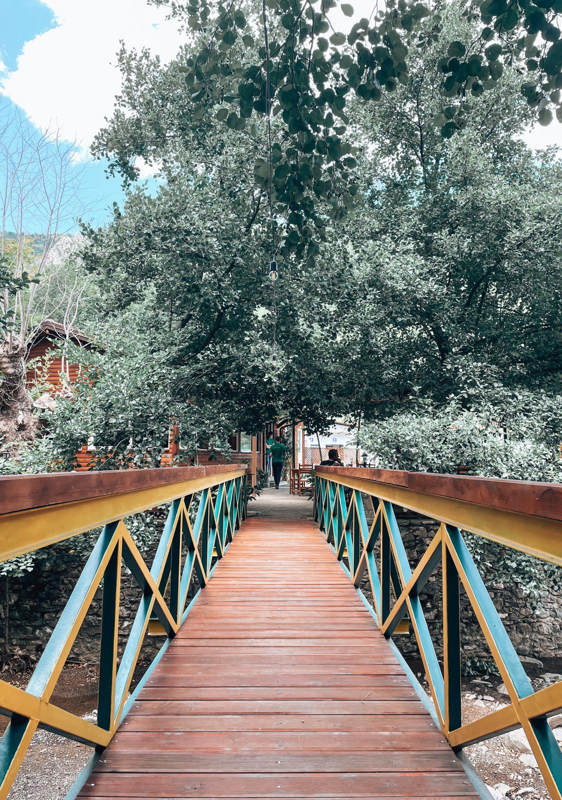 Exterior of Katundi i Vjeter restaurant with traditional stone architecture and rustic decor. A cultural dining experience often enjoyed when traveling near the Albania Montenegro border crossing.