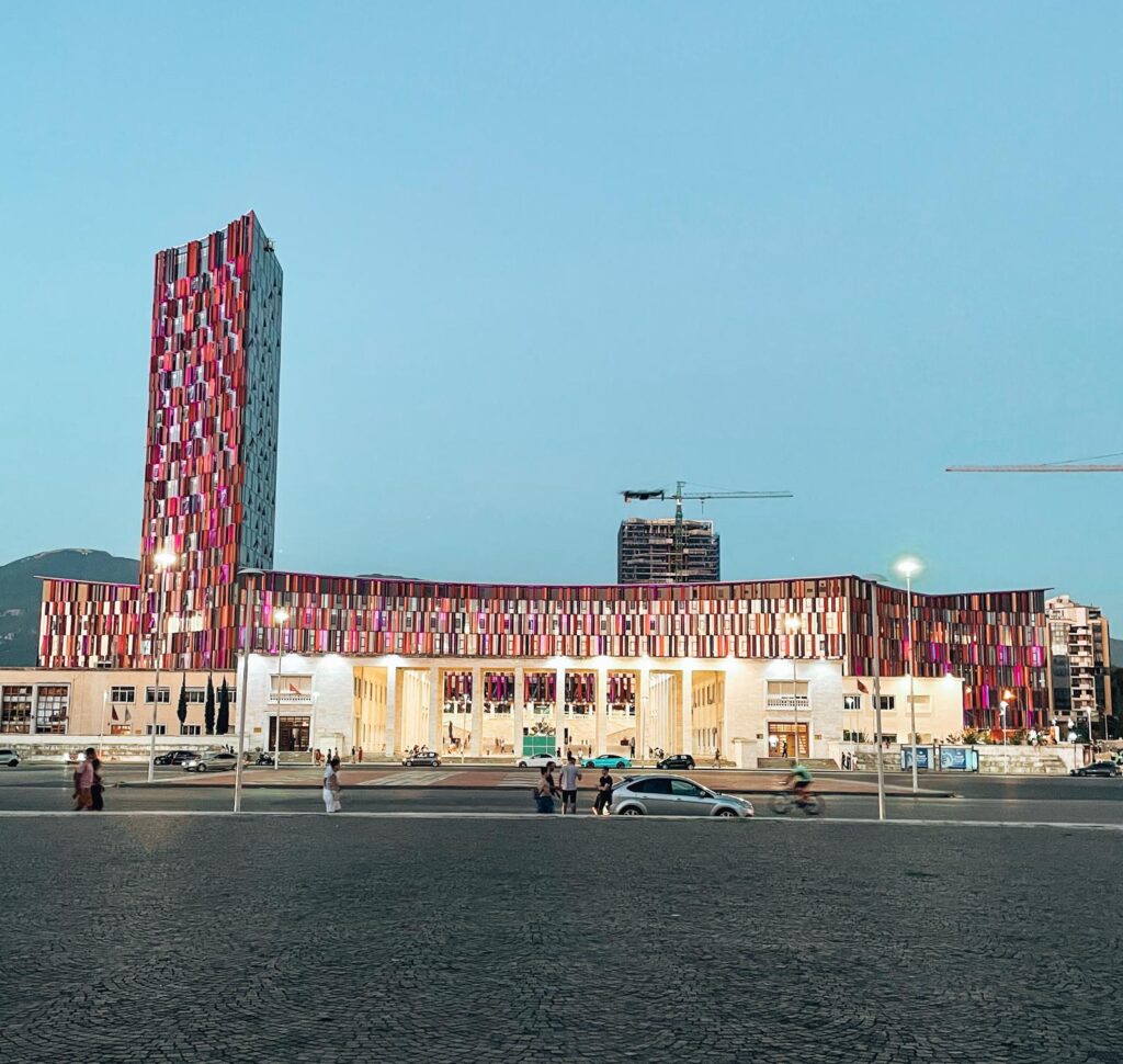 Wide view of Air Albania Stadium in Tirana with its modern exterior and surrounding city skyline. Visiting this landmark is one of the notable things to do in Tirana as travelers explore the capital after arriving in Albania.