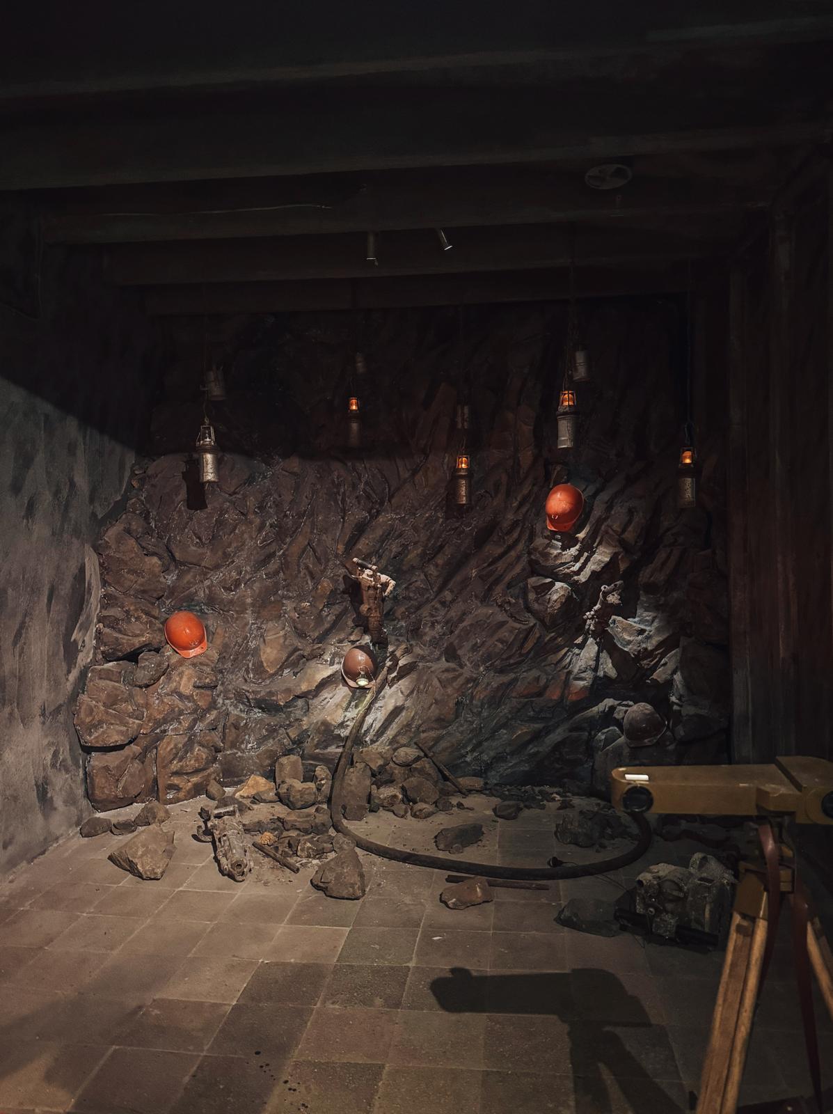 A mine with dark tunnels and rough rock walls where minerals are extracted, representing the harsh working conditions during Albania’s communist era. The setting adds context to visiting a bunker in Albania and understanding the country’s industrial past.